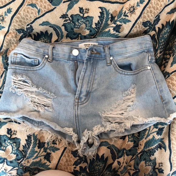 light wash ripped jean shorts
